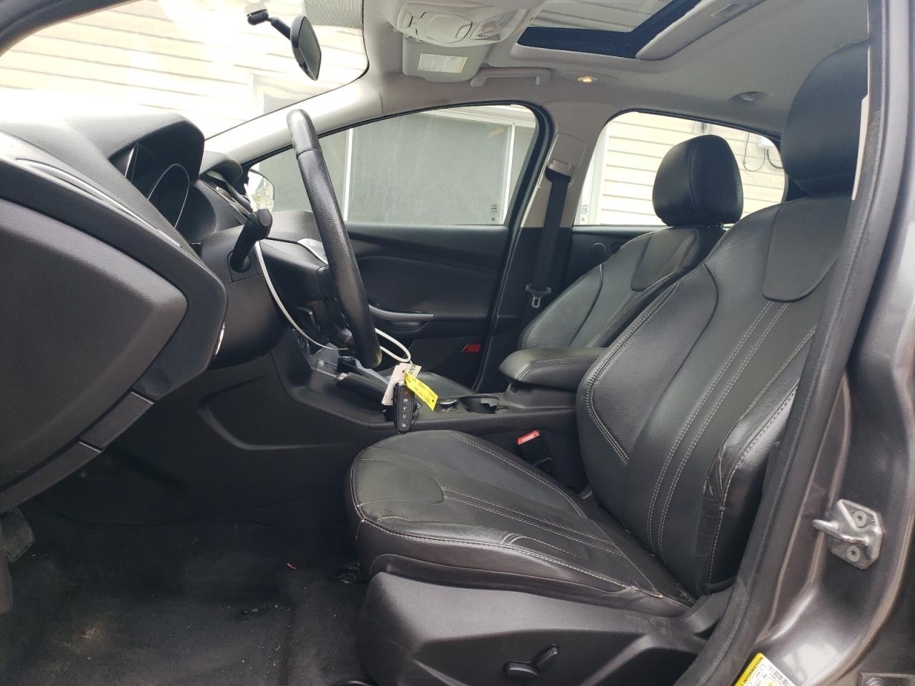 2014 Ford Focus Titanium VIN: 1FADP3J27EL205504 Lot: 97222515