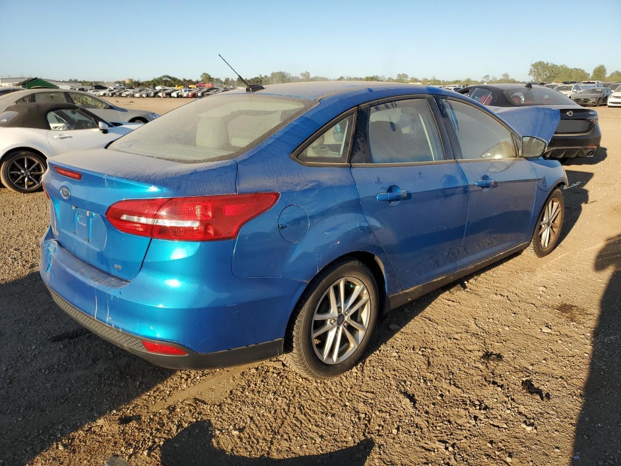 2015 Ford Focus Se VIN: 1FADP3F28FL329887 Lot: 69339594