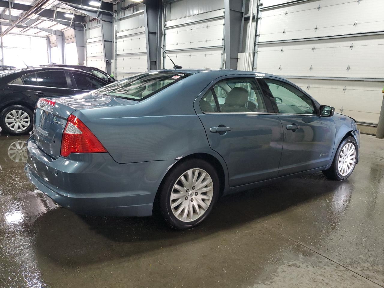 2011 Ford Fusion Hybrid VIN: 3FADP0L31BR234885 Lot: 69815454