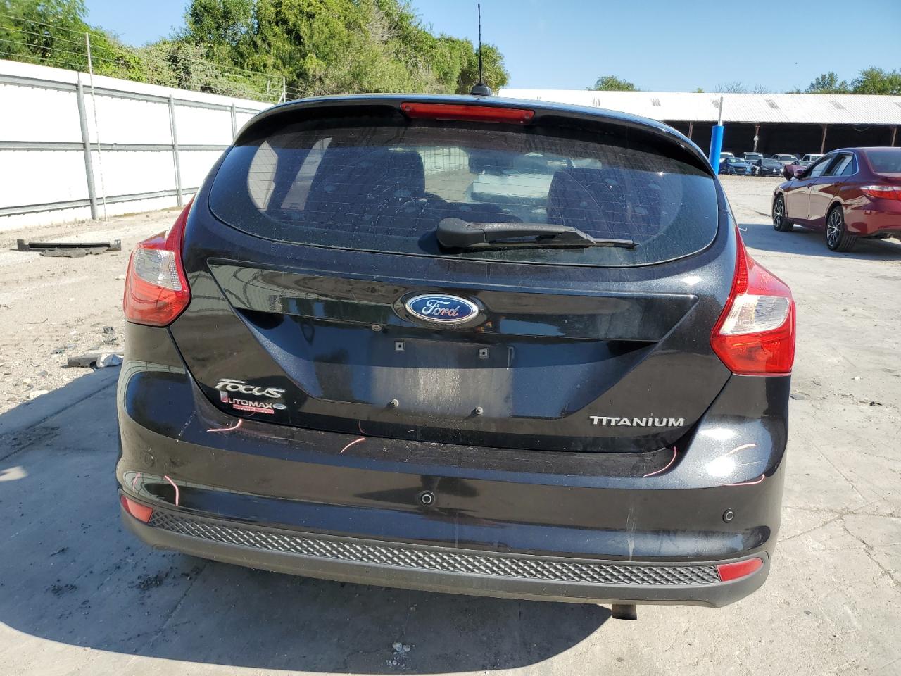 2012 Ford Focus Titanium VIN: 1FAHP3N28CL320749 Lot: 71052464