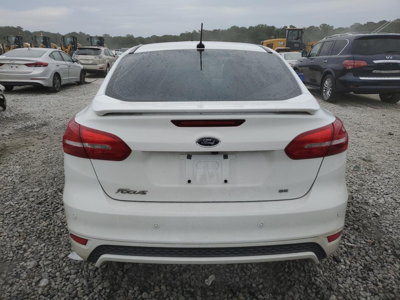 2016 Ford Focus Se VIN: 1FADP3F25GL304883 Lot: 71003354