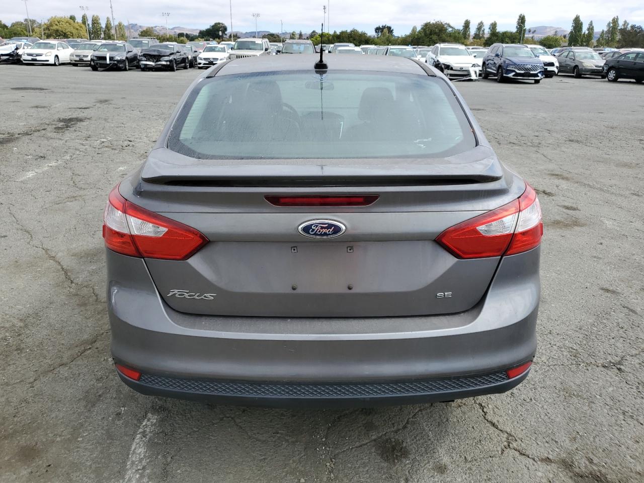 2014 Ford Focus Se VIN: 1FADP3F22EL302750 Lot: 70860294