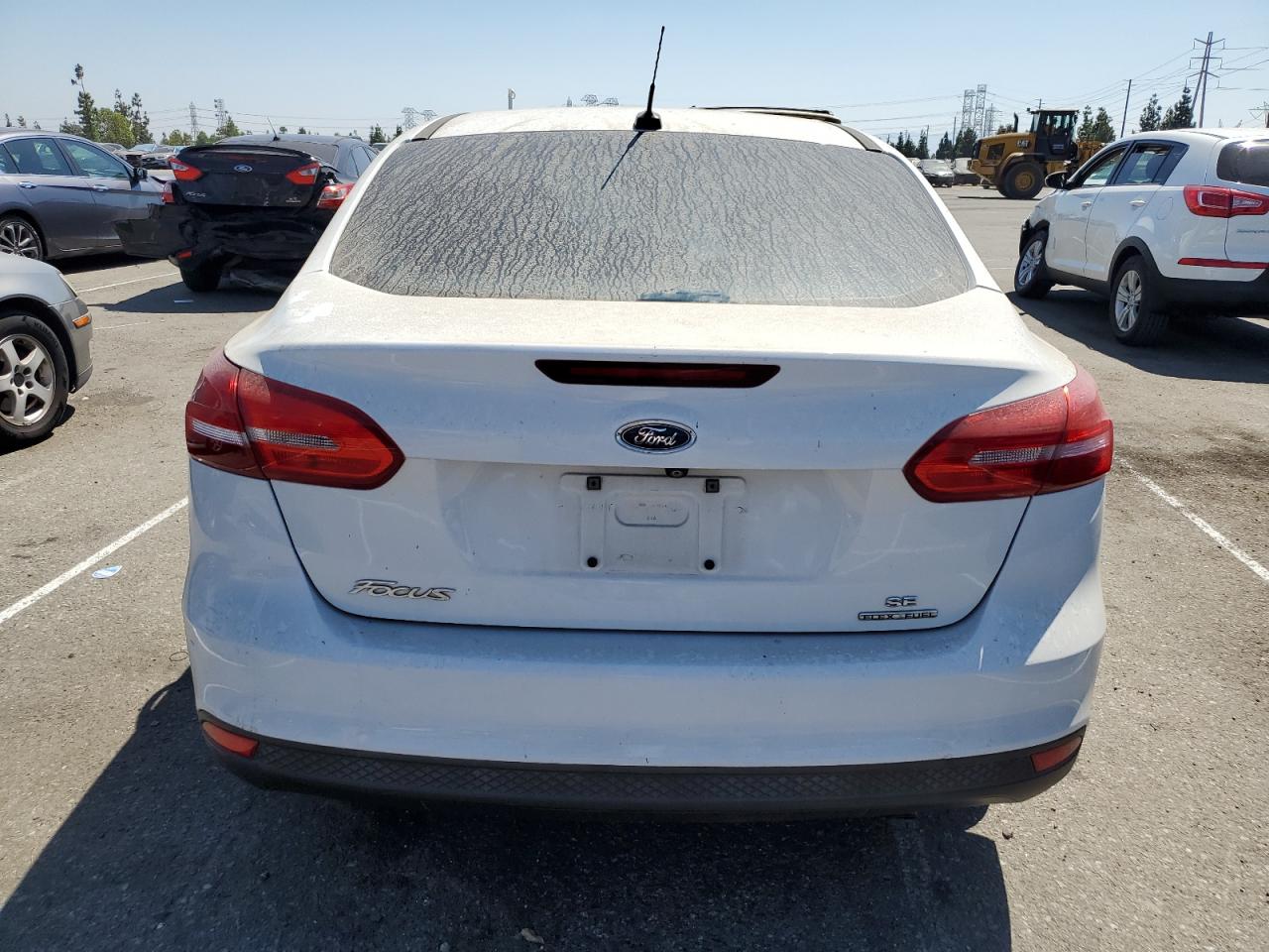 2015 Ford Focus Se VIN: 1FADP3F24FL211108 Lot: 70242244