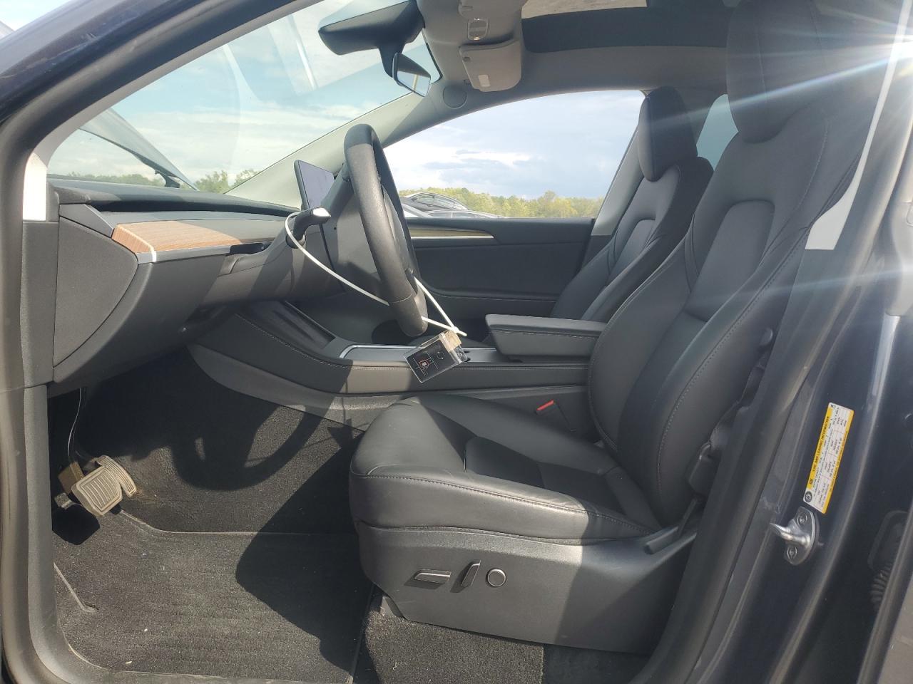 2023 Tesla Model Y VIN: 7SAYGDEE5PA096777 Lot: 84195225