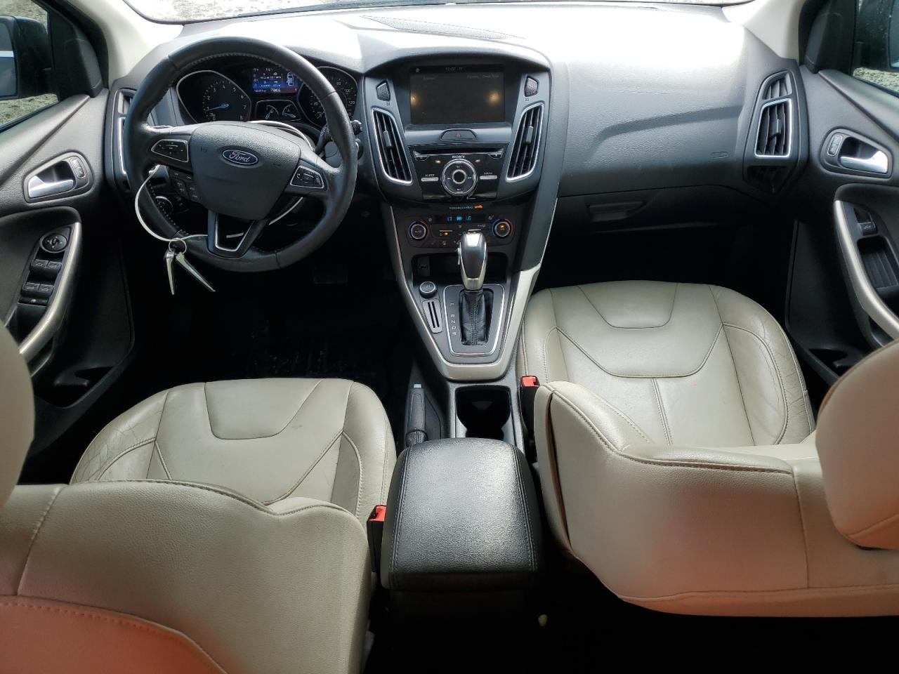 2016 Ford Focus Titanium VIN: 1FADP3N27GL332640 Lot: 81454045