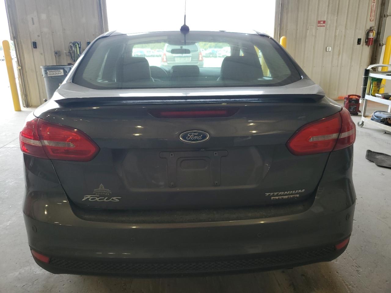 2015 Ford Focus Titanium VIN: 1FADP3J20FL231220 Lot: 80630245