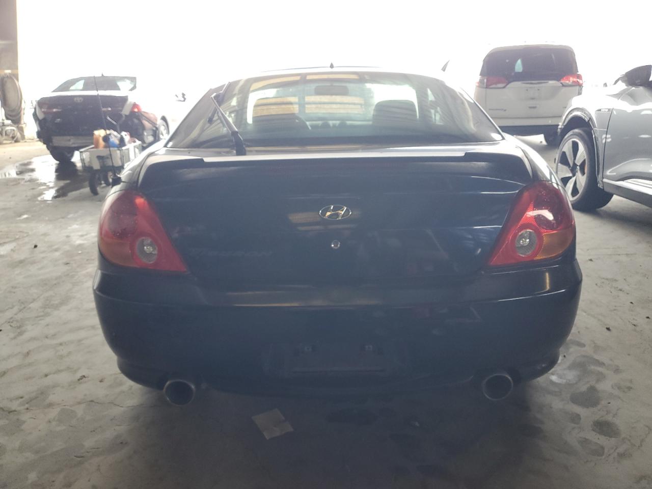 2004 Hyundai Tiburon VIN: KMHHM65D04U107131 Lot: 72101305