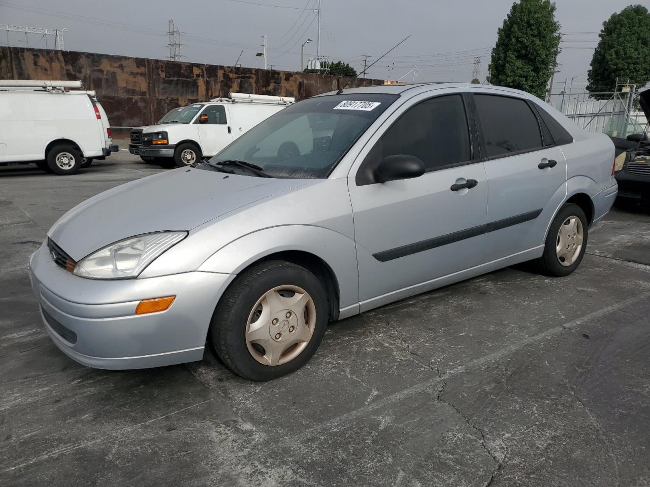 2002 Ford Focus Lx silver sedan gas 1FAFP33P32W140422 photo #1
