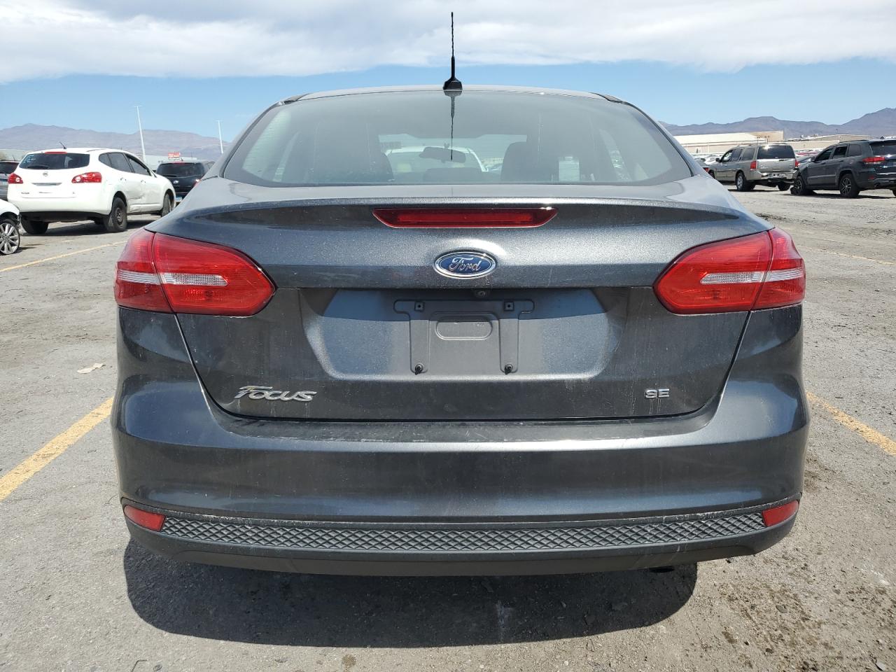 2018 Ford Focus Se VIN: 1FADP3F25JL304079 Lot: 82080335