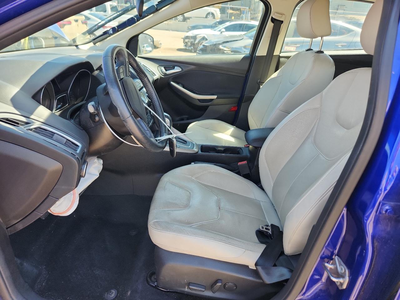 2015 Ford Focus Titanium VIN: 1FADP3N27FL379763 Lot: 71919255