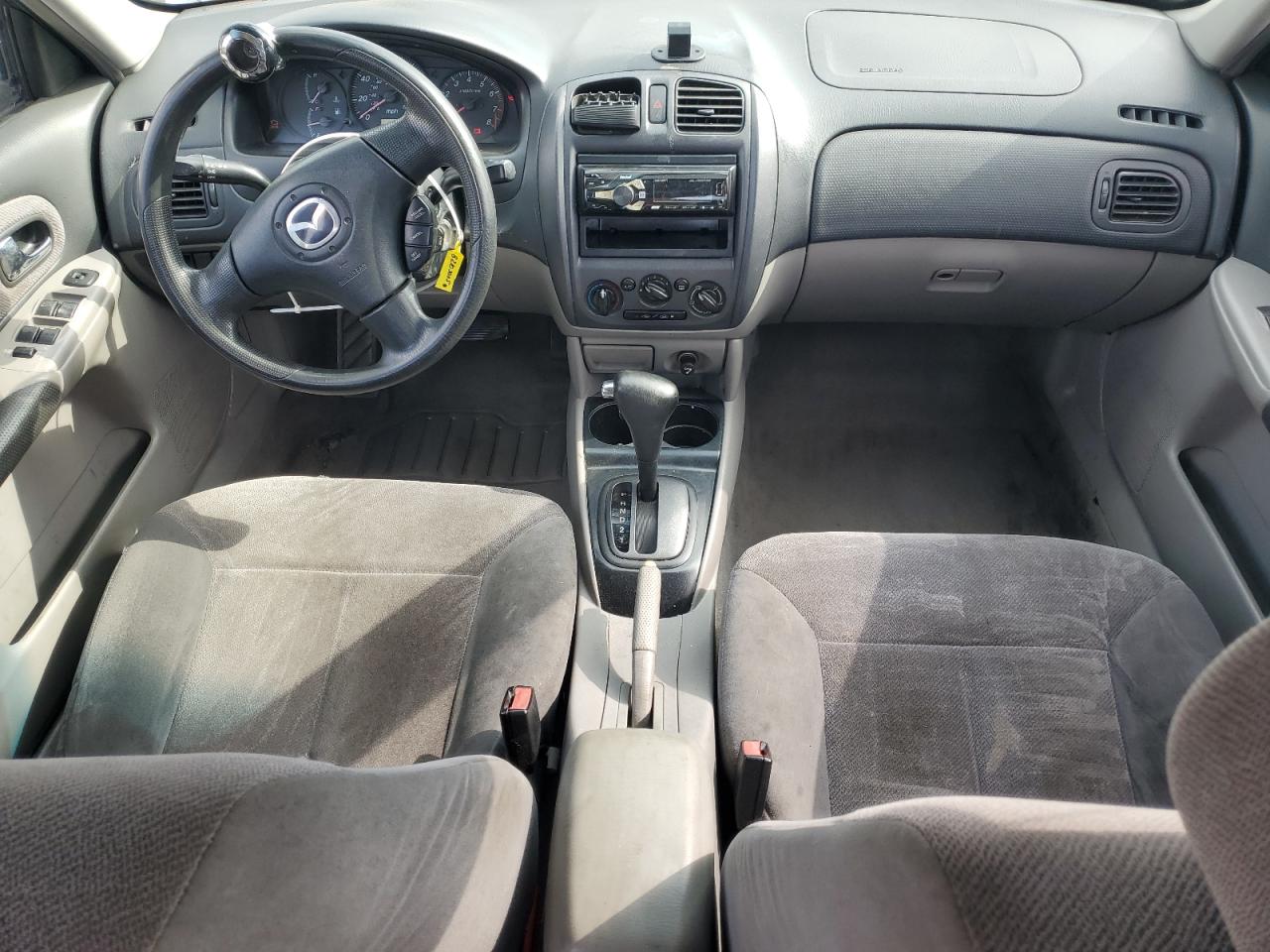 2002 Mazda Protege Dx VIN: JM1BJ225221617049 Lot: 82103005