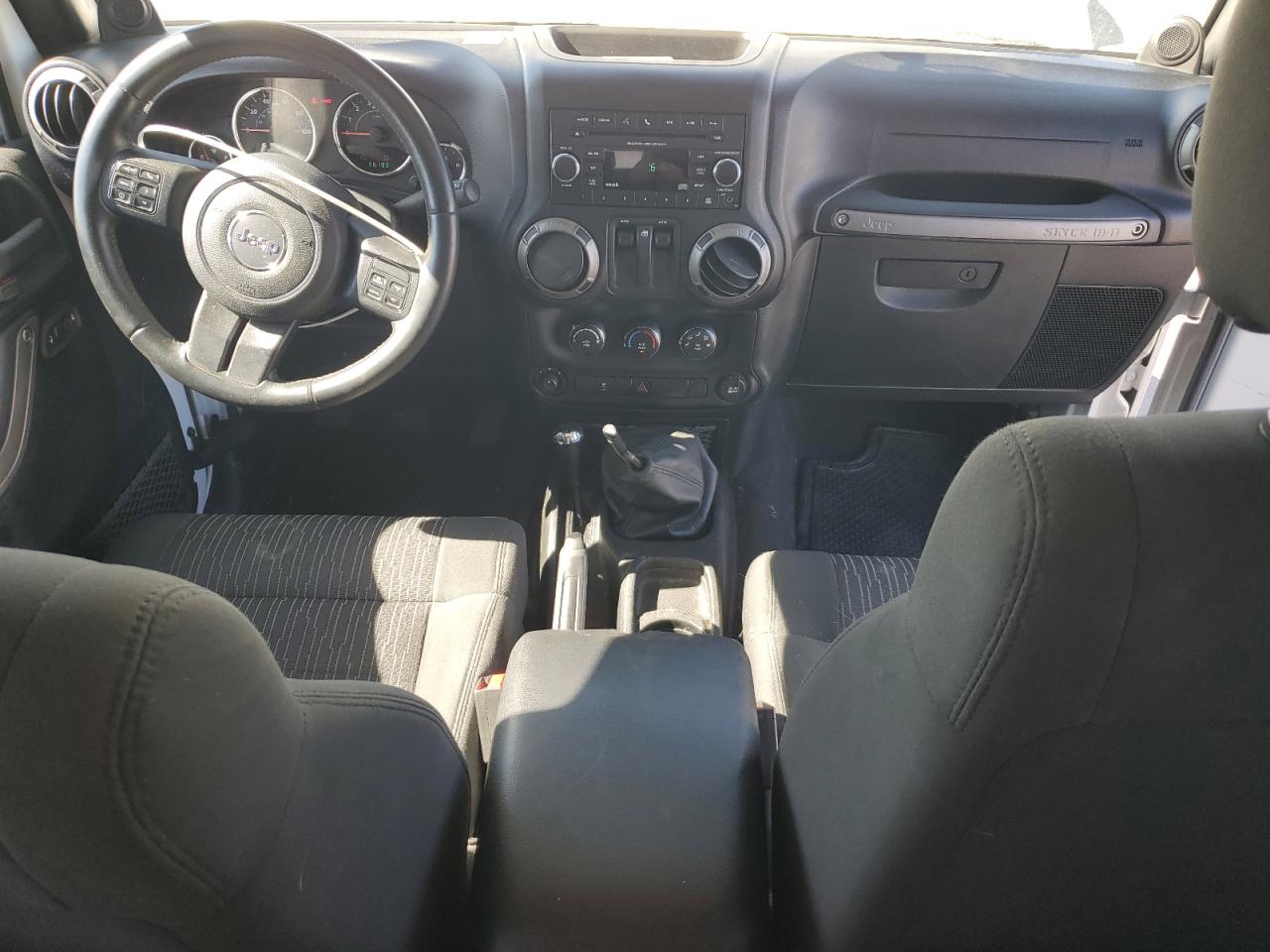 2012 Jeep Wrangler Sport VIN: 1C4AJWAGXCL208390 Lot: 80902665