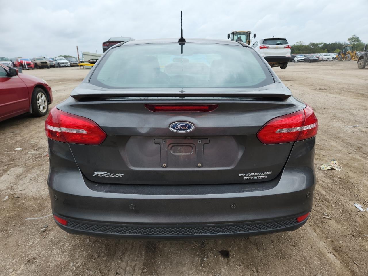 2016 Ford Focus Titanium VIN: 1FADP3J21GL216033 Lot: 81639745