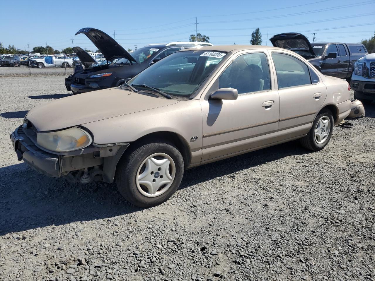 FORD CONTOUR 1999. Lot# 81102035. VIN 1FAFP6537XK201071. Photo 1
