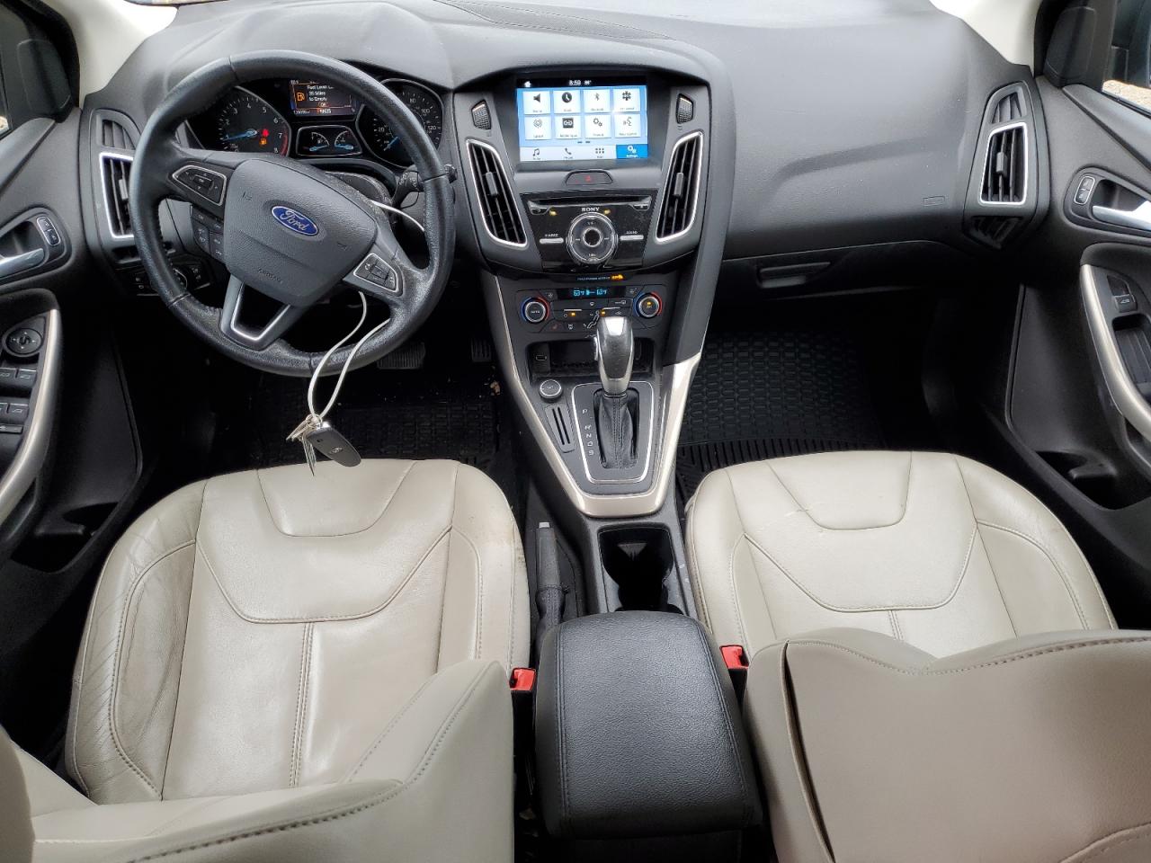 2016 Ford Focus Titanium VIN: 1FADP3N23GL302616 Lot: 81018465