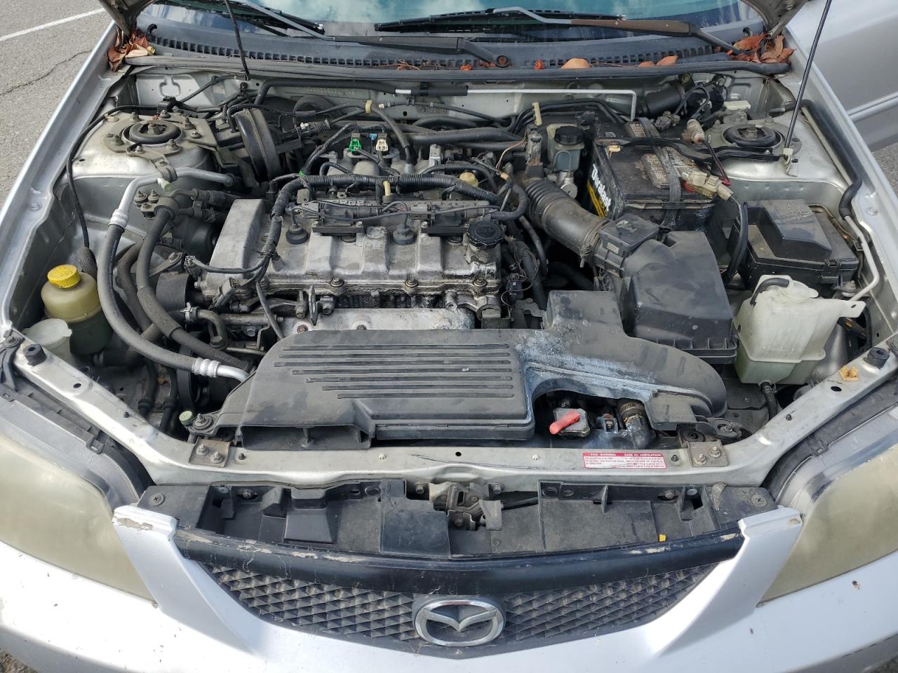 2002 Mazda Protege Dx VIN: JM1BJ225221617049 Lot: 82103005