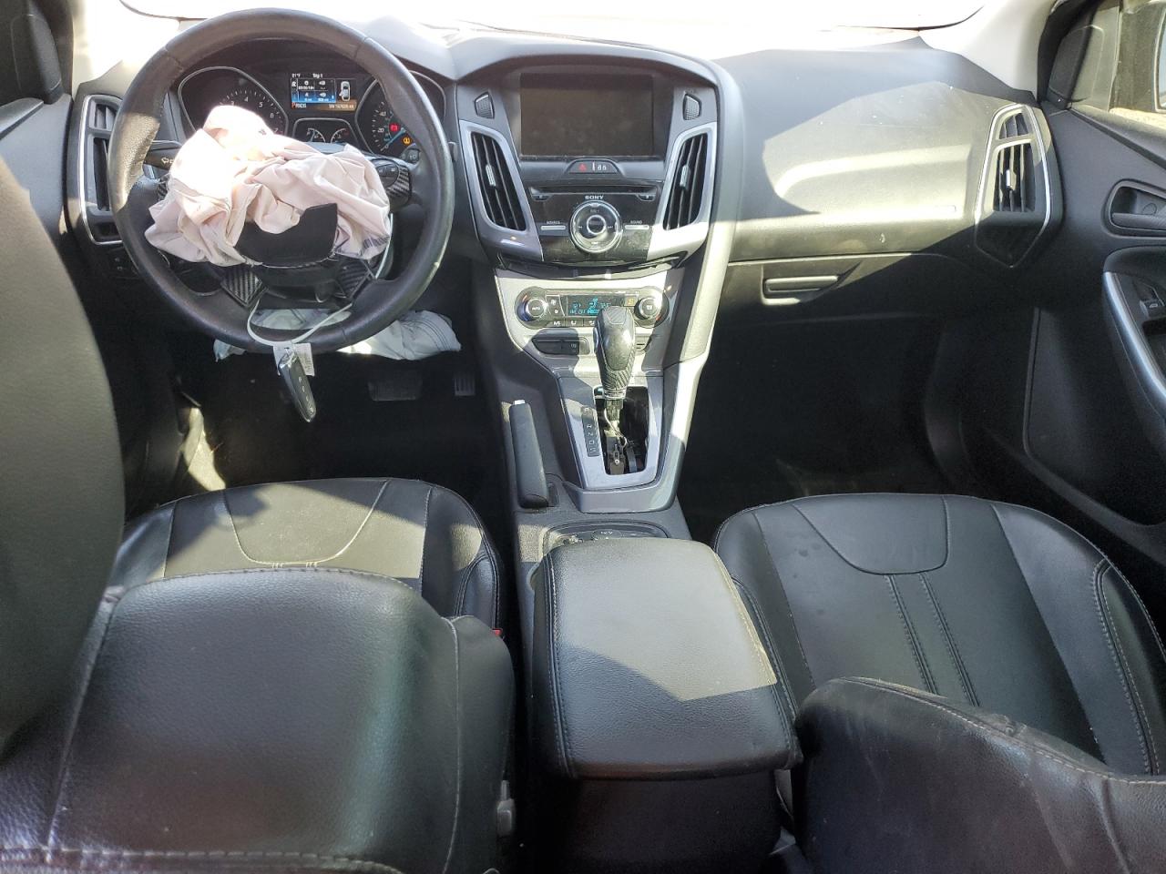 2014 Ford Focus Titanium VIN: 1FADP3J20EL253412 Lot: 83834645