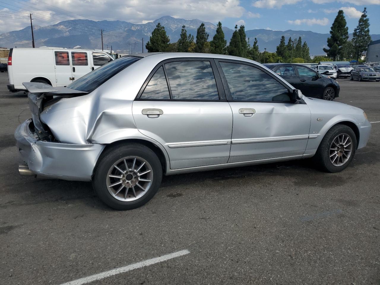 2002 Mazda Protege Dx VIN: JM1BJ225221617049 Lot: 82103005