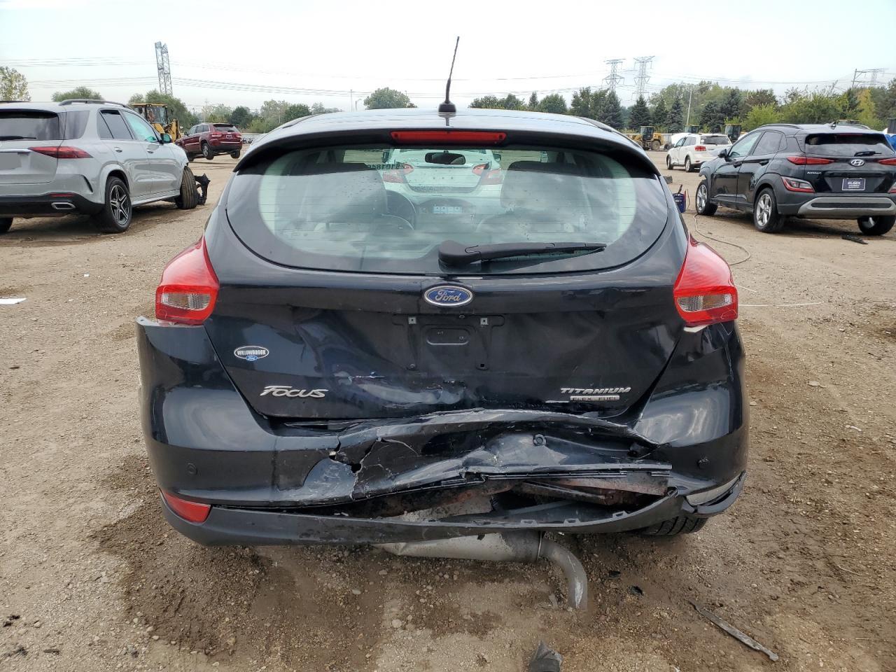 2016 Ford Focus Titanium VIN: 1FADP3N23GL302616 Lot: 81018465