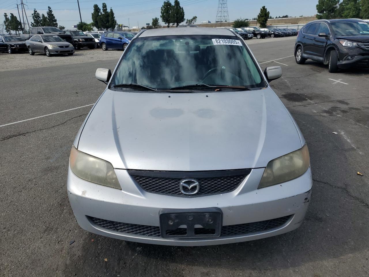 2002 Mazda Protege Dx VIN: JM1BJ225221617049 Lot: 82103005