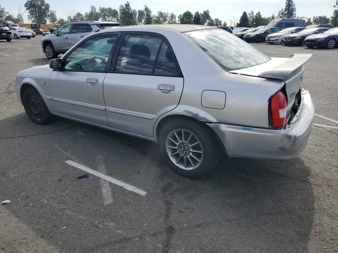 2002 Mazda Protege Dx VIN: JM1BJ225221617049 Lot: 82103005