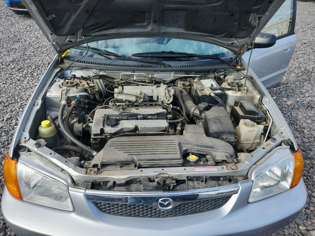 2000 Mazda Protege Dx VIN: JM1BJ2226Y0241394 Lot: 84044025