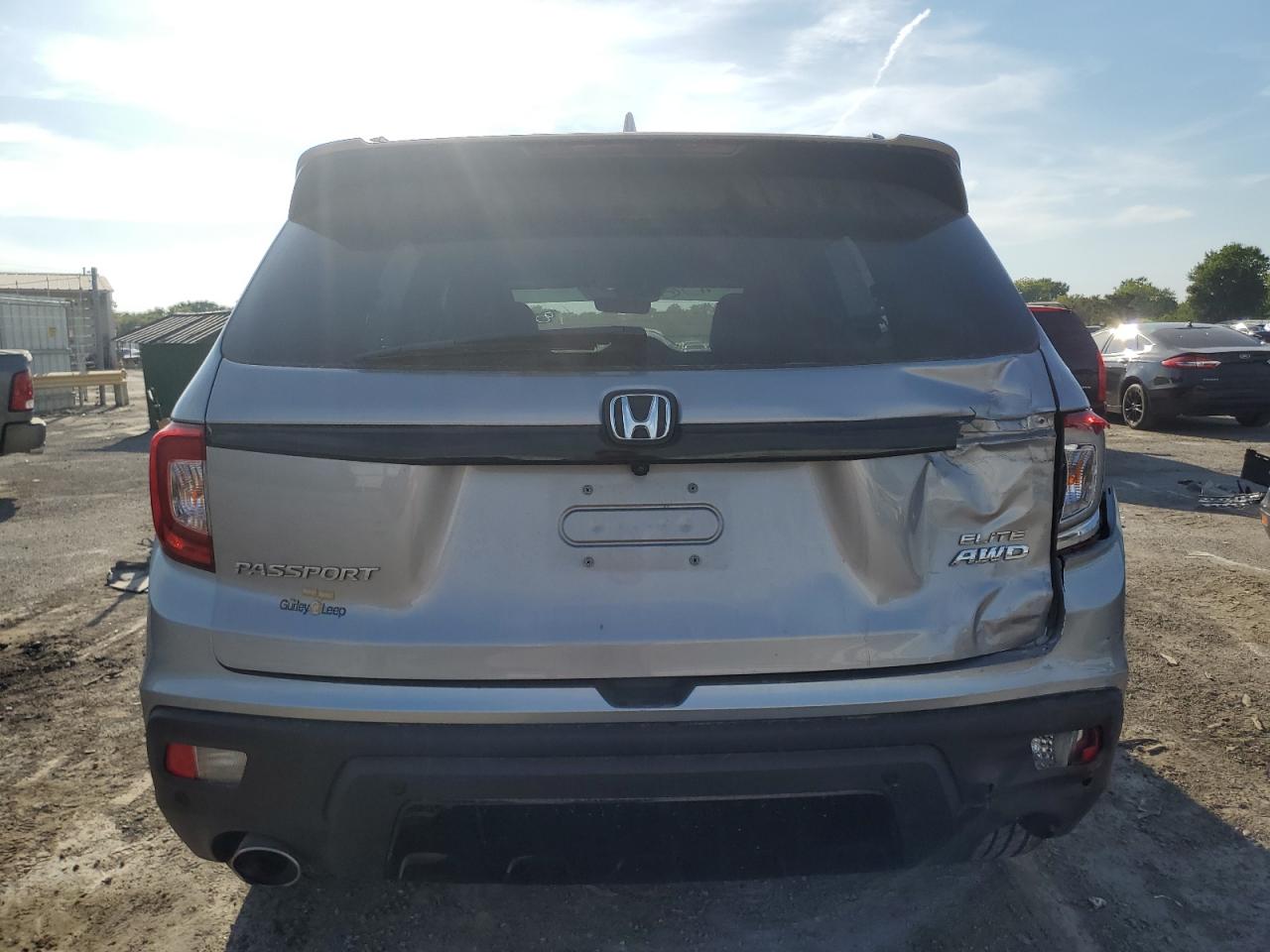 2021 Honda Passport Elite VIN: 5FNYF8H07MB029247 Lot: 71735125