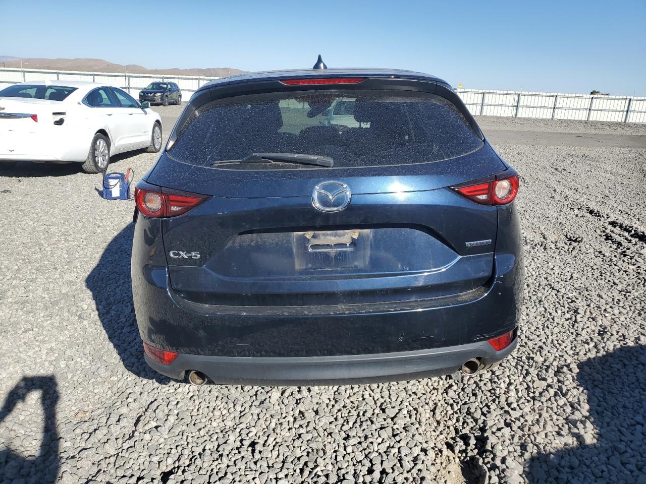 2021 Mazda Cx-5 Grand Touring VIN: JM3KFADM7M1376664 Lot: 70340965