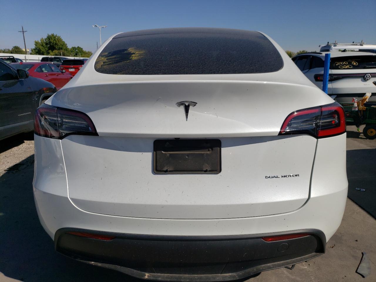 2023 Tesla Model Y VIN: 7SAYGDEE2PF703494 Lot: 74630604