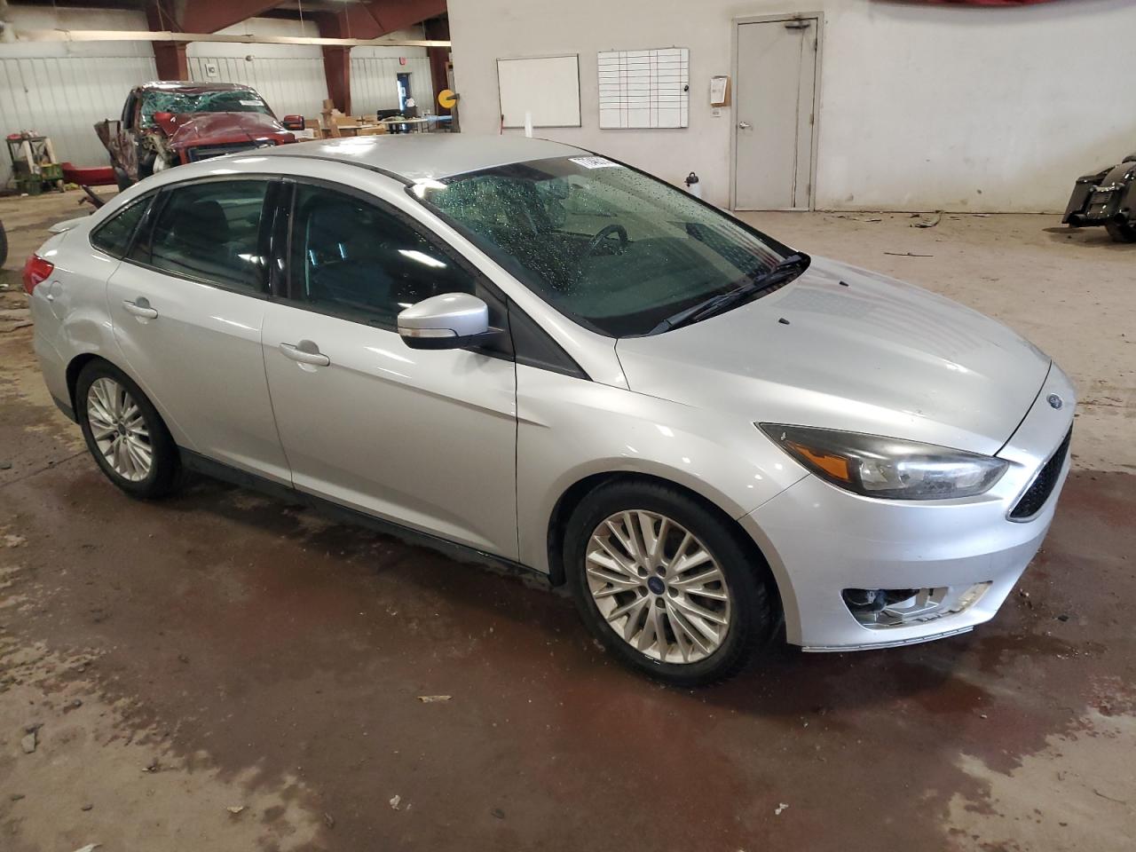 VIN 1FADP3F27FL257029 2015 FORD FOCUS no.4