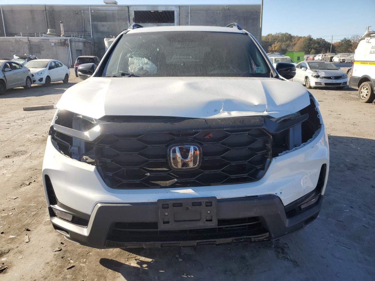 2022 Honda Passport Elite VIN: 5FNYF8H06NB012702 Lot: 76440494