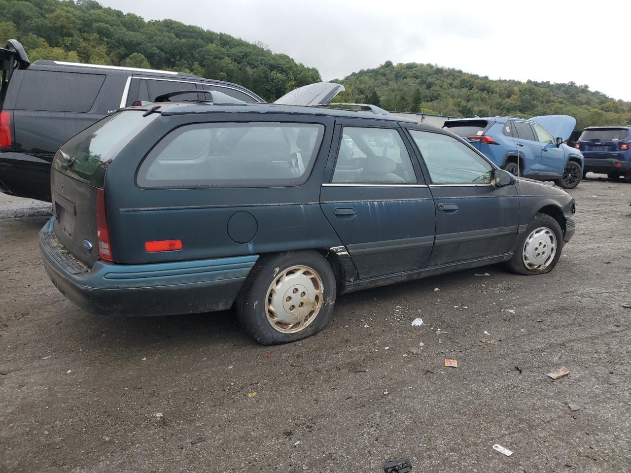 1995 Ford Taurus Gl VIN: 1FALP57U7SA210516 Lot: 73996664