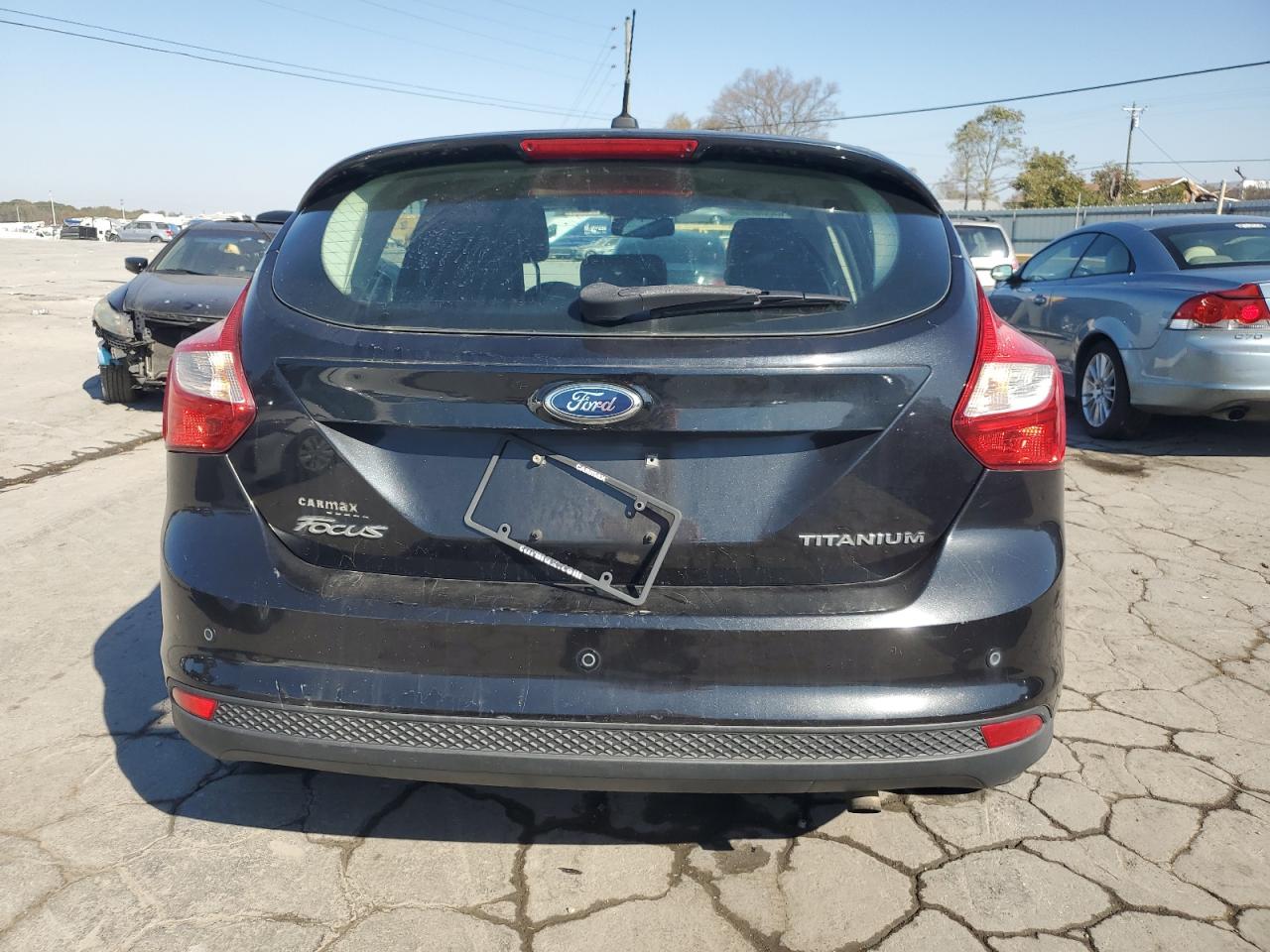 2012 Ford Focus Titanium VIN: 1FAHP3N24CL306671 Lot: 77557234