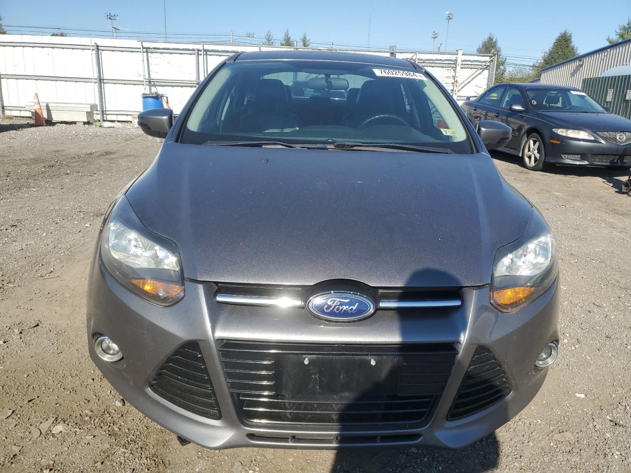 2014 Ford Focus Titanium VIN: 1FADP3J20EL357060 Lot: 76025984