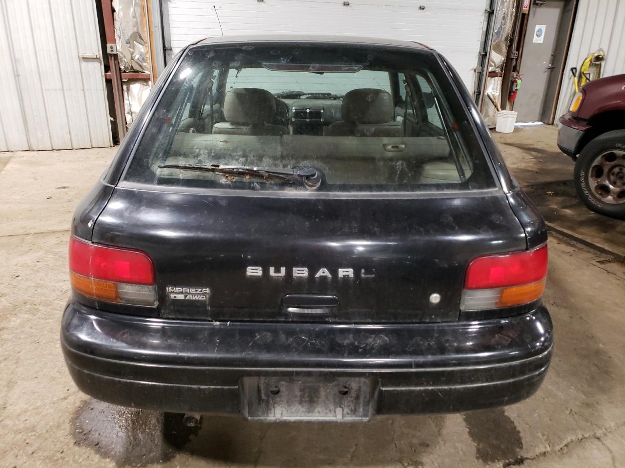 1999 Subaru Impreza L VIN: JF1GF435XXH810961 Lot: 75751854