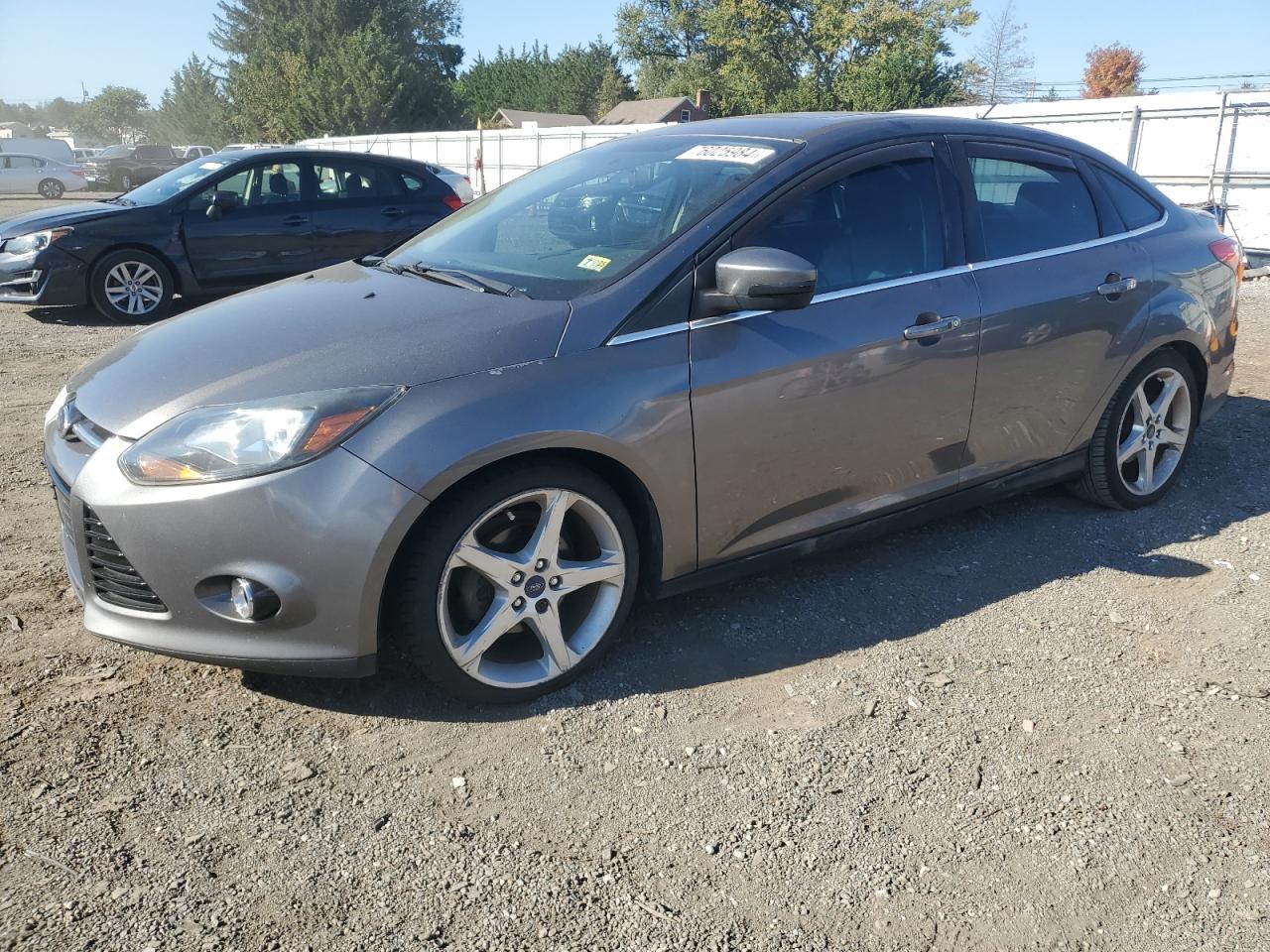 2014 Ford Focus Titanium VIN: 1FADP3J20EL357060 Lot: 76025984