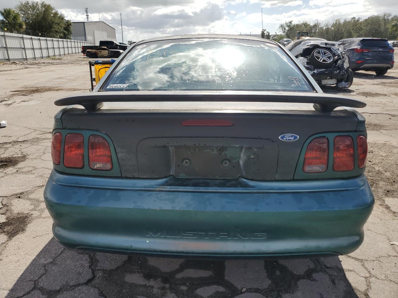 1997 Ford Mustang VIN: 1FALP4043VF102860 Lot: 77269384