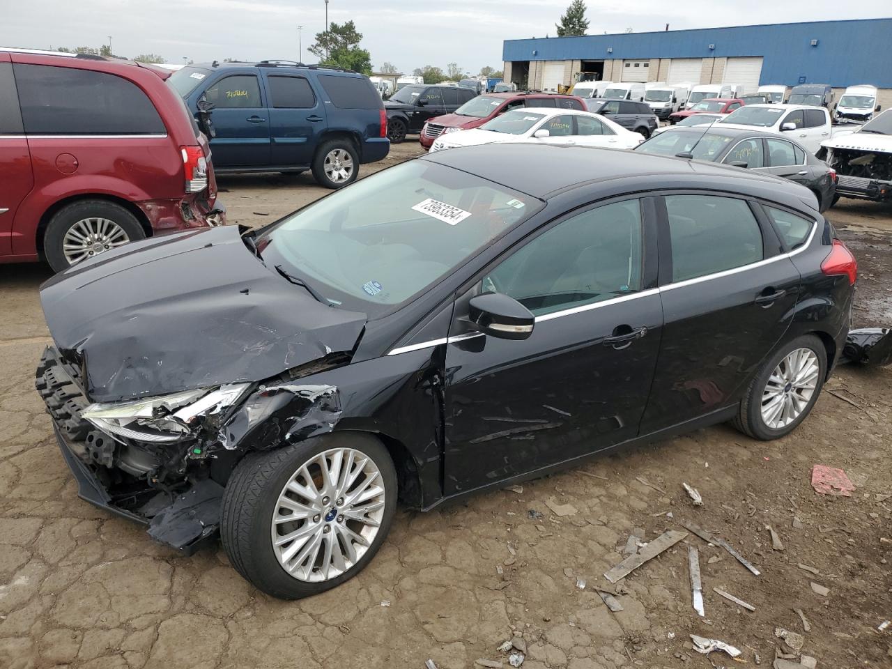 2016 Ford Focus Titanium VIN: 1FADP3N25GL383005 Lot: 73963354