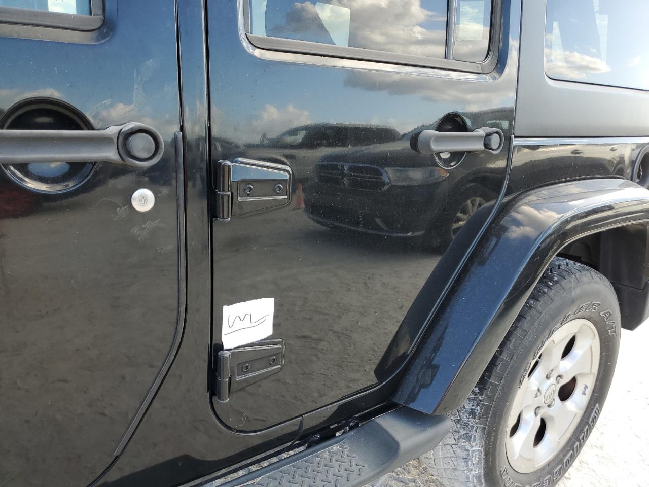 2014 Jeep Wrangler Unlimited Sahara VIN: 1C4BJWEG2EL202701 Lot: 75243104