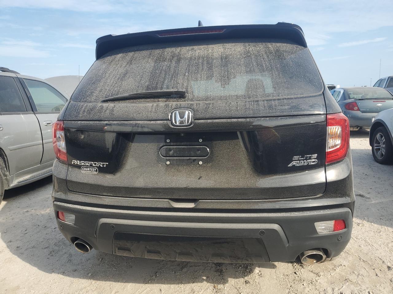 2021 Honda Passport Elite VIN: 5FNYF8H00MB010068 Lot: 76408844