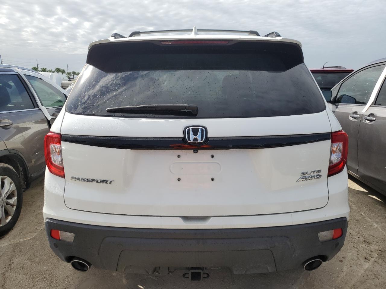 2019 Honda Passport Elite VIN: 5FNYF8H06KB000402 Lot: 74619844