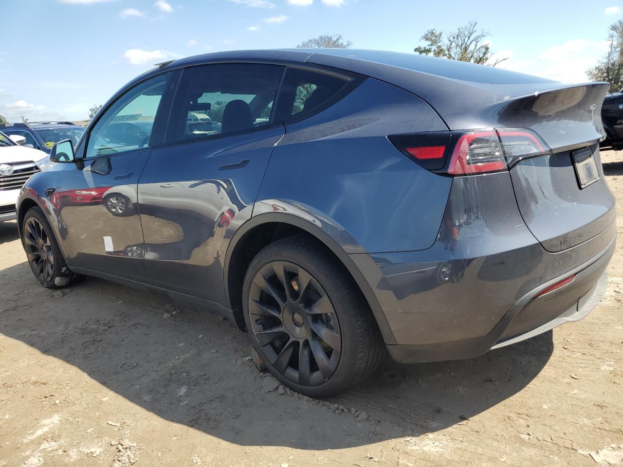 2023 Tesla Model Y VIN: 7SAYGDEE8PA056810 Lot: 74310204