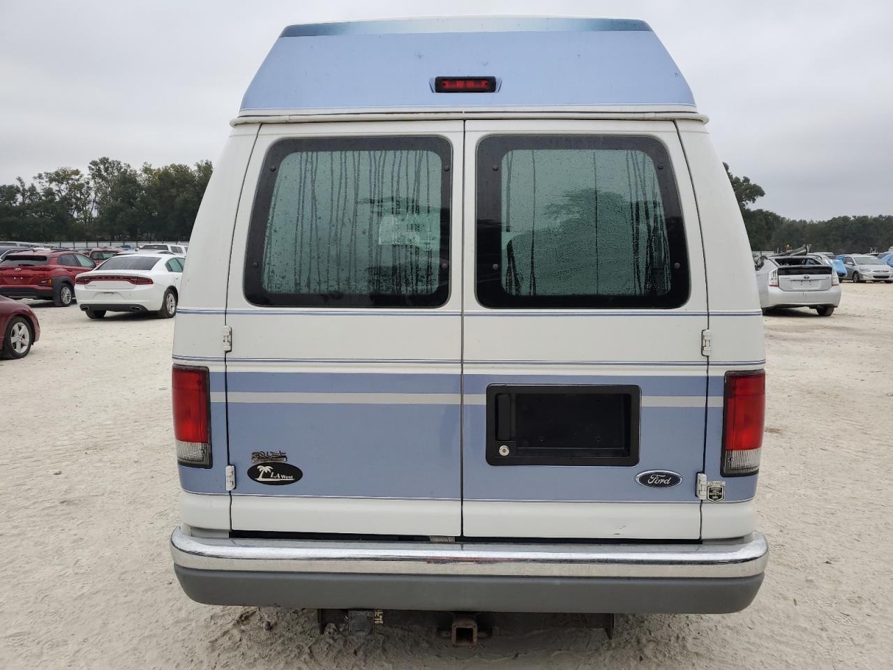 1999 Ford Econoline E150 Van VIN: 1FDRE14LXXHA76867 Lot: 78060454