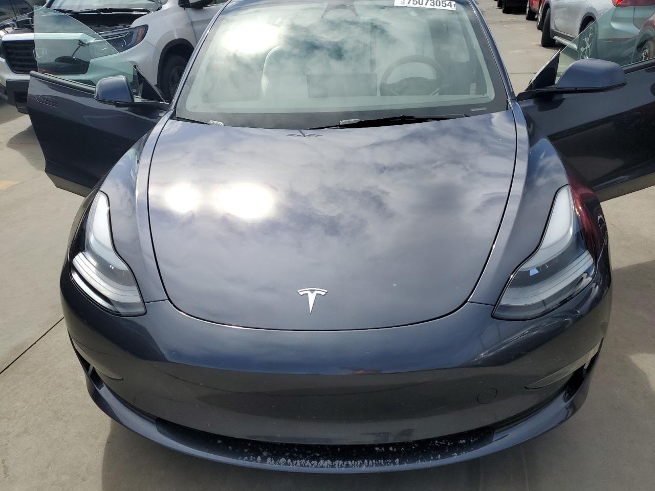 2023 Tesla Model 3 VIN: 5YJ3E1EC2PF677330 Lot: 75073054