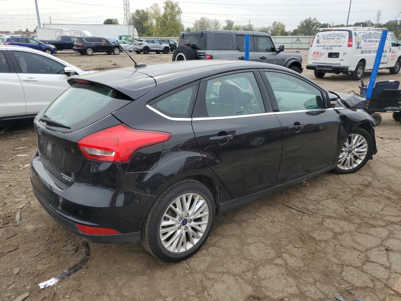 2016 Ford Focus Titanium VIN: 1FADP3N25GL383005 Lot: 73963354