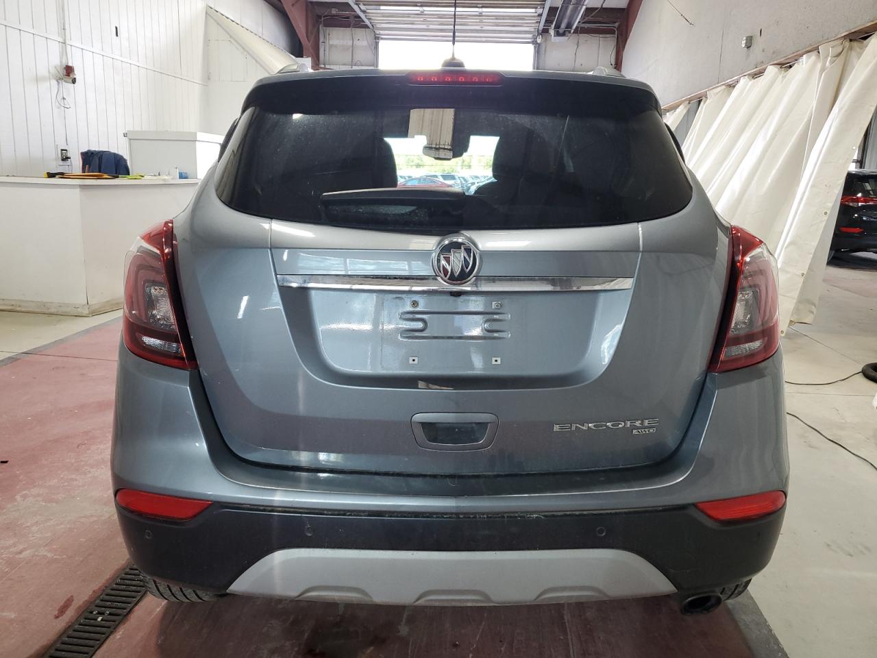 2019 Buick Encore Essence VIN: KL4CJGSM5KB863302 Lot: 74344234