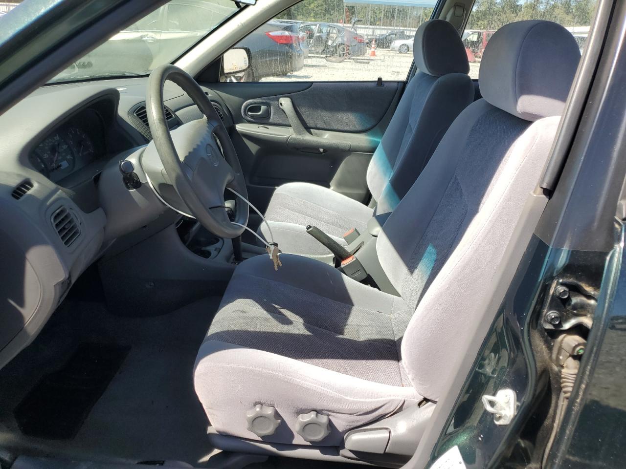 1999 Mazda Protege Es VIN: JM1BJ2214X0139596 Lot: 85183855