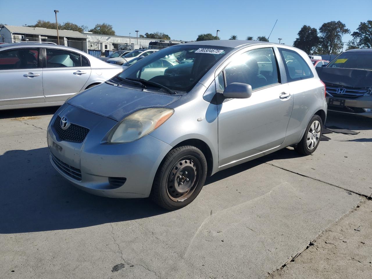 TOYOTA YARIS 2007. Lot# 90304675. VIN JTDJT923675095569. Photo 1