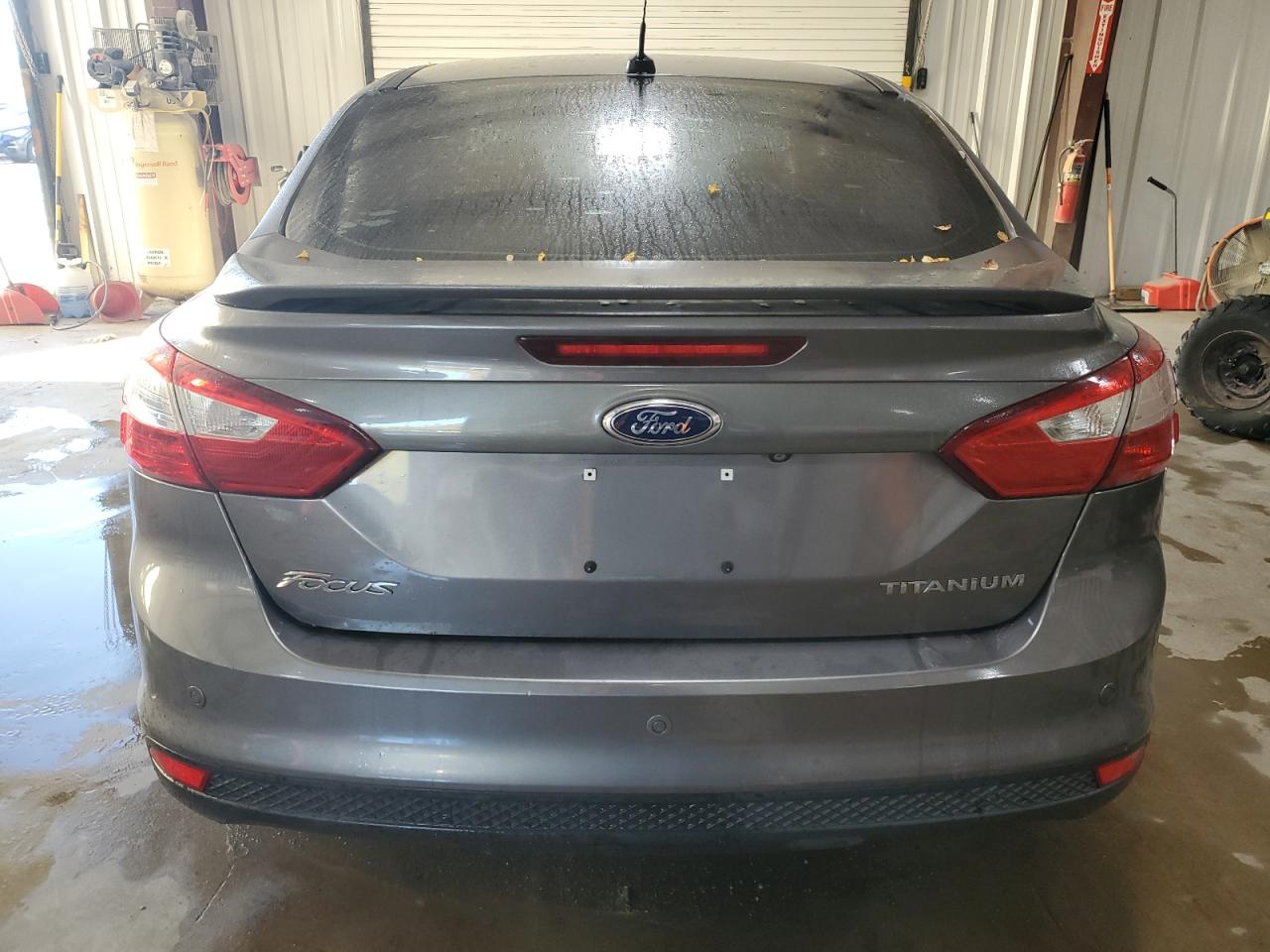 2014 Ford Focus Titanium VIN: 1FADP3J21EL121002 Lot: 84613095