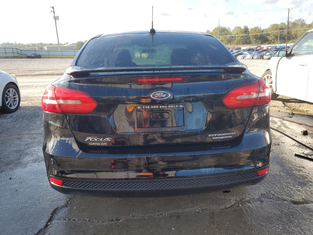 2016 Ford Focus Titanium VIN: 1FADP3J21GL245807 Lot: 85719655